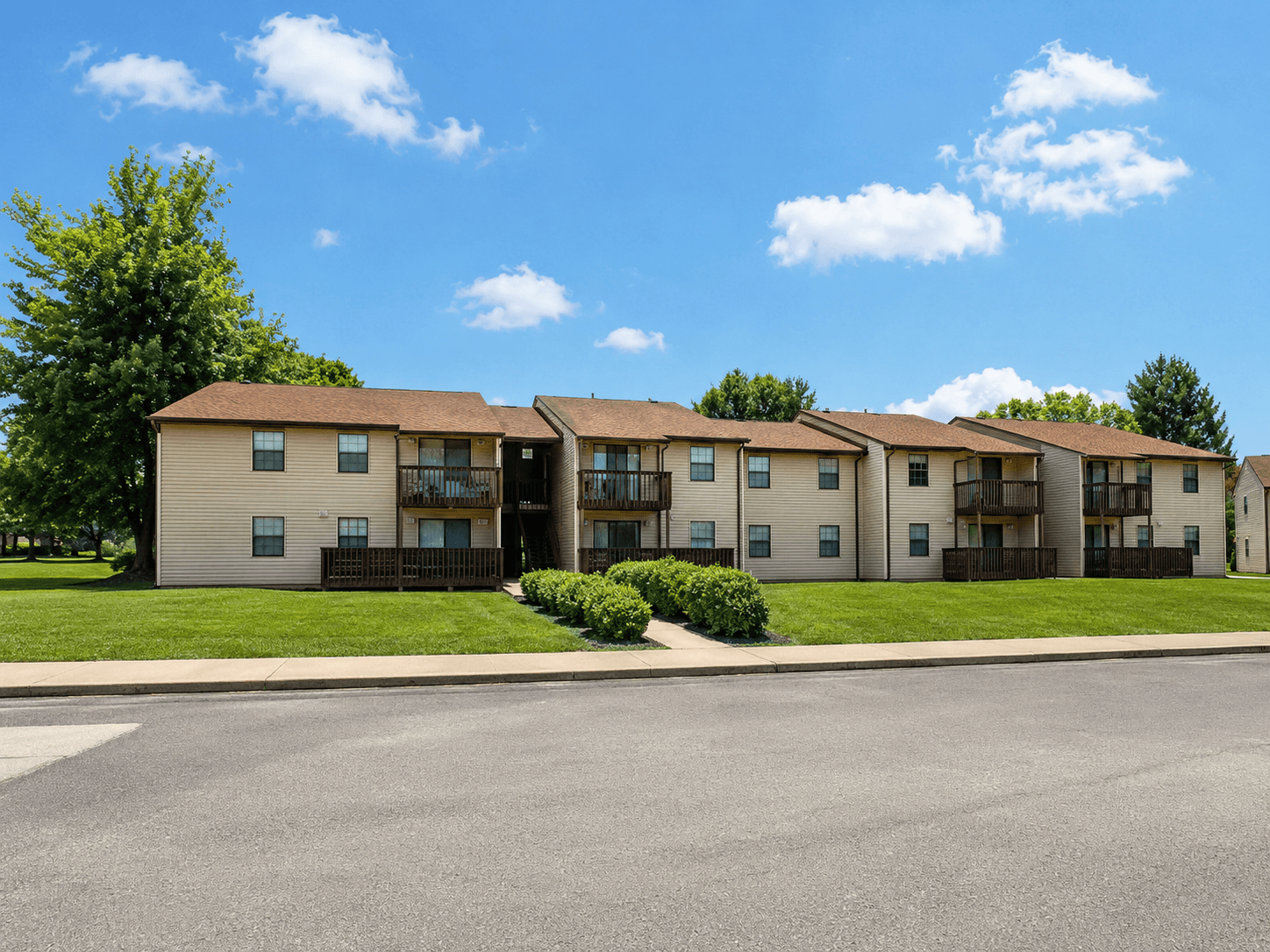 Apartment complex with a clear blue sky above.